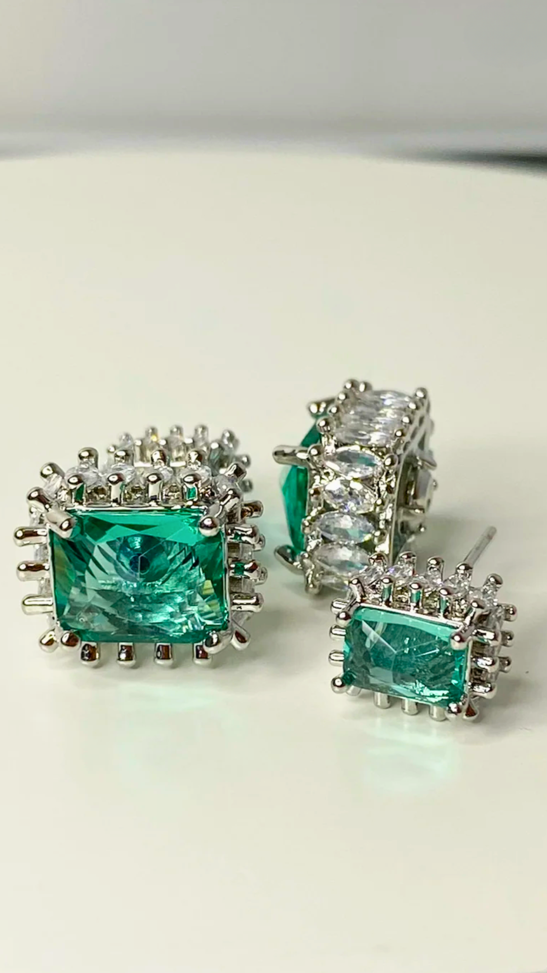 Elegant green tourmaline and cubic zirconia earrings, sparkling with sophistication and adding a touch of glamour to any ensemble.