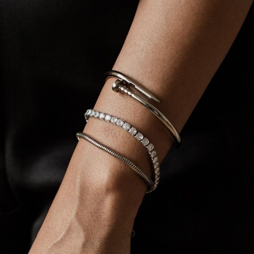 The bracelet displayed flat, showcasing its elegant design and sparkling crystals.